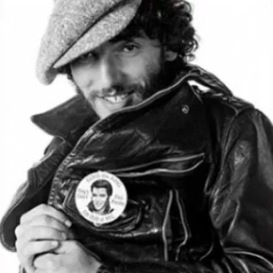 Bruce Springsteen proudly displays an Elvis Presley fan club badge in a photo taken by Eric Meola. This outtake from the photo session for the 'Born to Run' album cover is seen in Dennis P. Laverty's new documentary, 'If I Can Dream: The Influence of Elvis on Bruce'. 